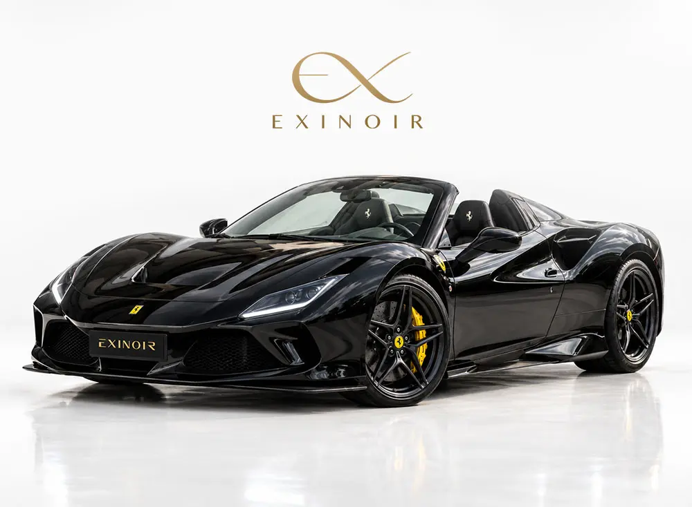 Ferrari F8 Spider with its retractable roof open in a modern European setting
